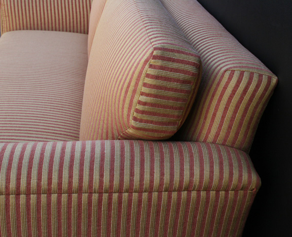 side view of organic sofa showing matched stripes & fitted cushion