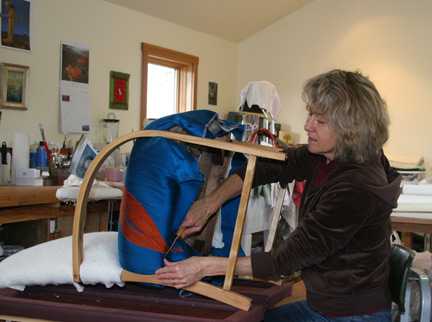 carla pyle working on a signature furniture design in her studio