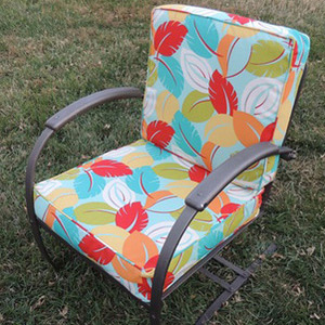 Boxed cushion upholstery class project with brightly colored leaf fabric