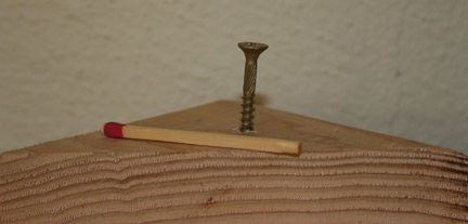 loose screw in wood block with match stick