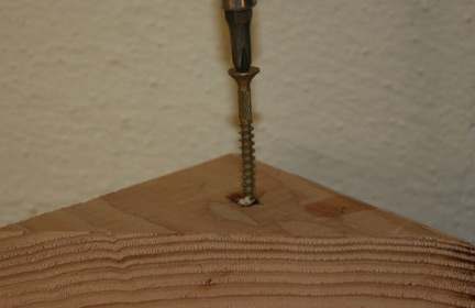 tightening screw in wood block with matchstick & glue for a tight fit