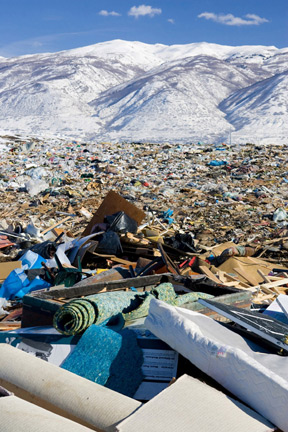 This landfill photo illustrates the need to keep furniture, bedding and anything we can out of landfills by using materials efficiently