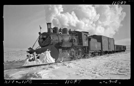 Steam engine with a snowplow by Warren McGee