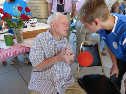 Warren McGee greets friends at his 100th birthday party