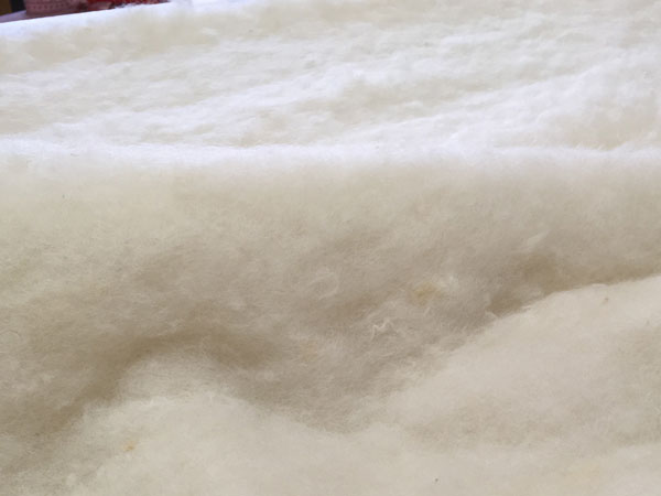 Premium wool batting for natural upholstery - detail image