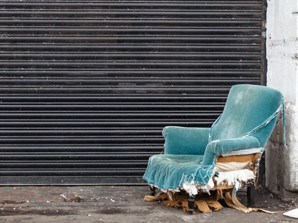 Sadly worn, hauntingly beautiful blue velvet arm chair Image by ed robertson (494387-unsplash)