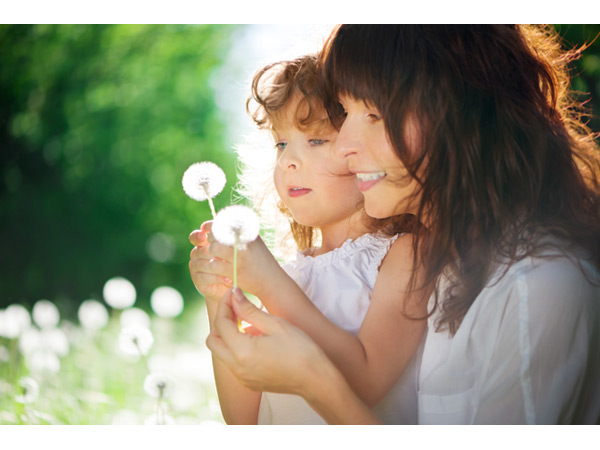 mother & child making a dandelion wish-34507775-copyright-Andreusk-Dreamstime